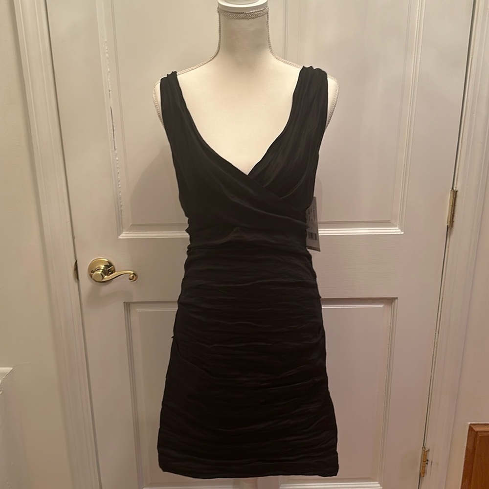 Nicole Miller Rouged black dress w/ criss cross straps.  Above knee Size 12